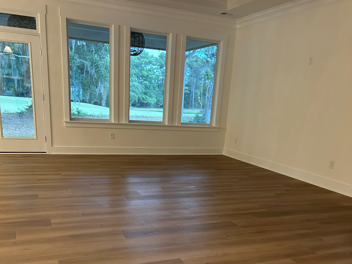 Wood-look luxury vinyl plank flooring installed by Genis Pacific in Shallotte, NC
