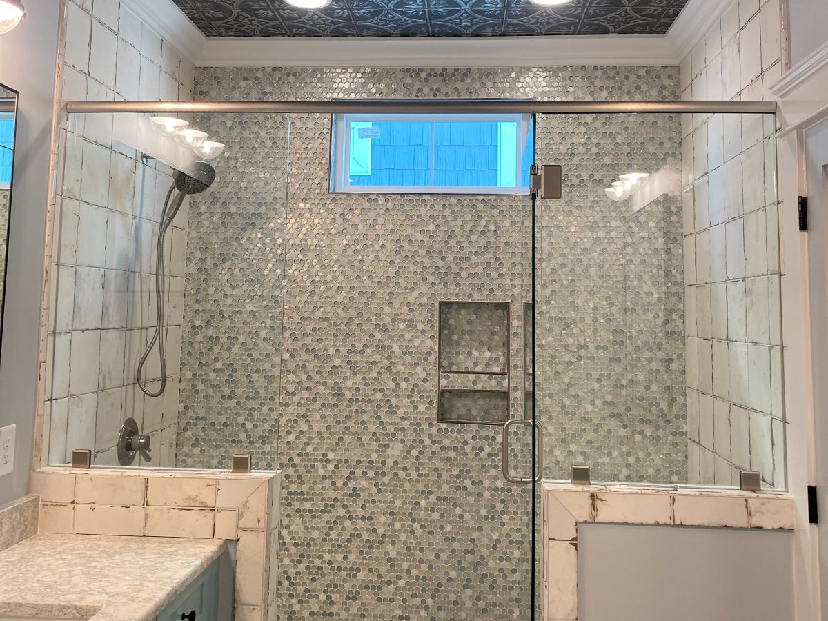 Glass-enclosed penny tile shower installed by Genis Pacific in Shallotte, NC